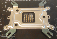 Back plate attached to bottom of AMD motherboard